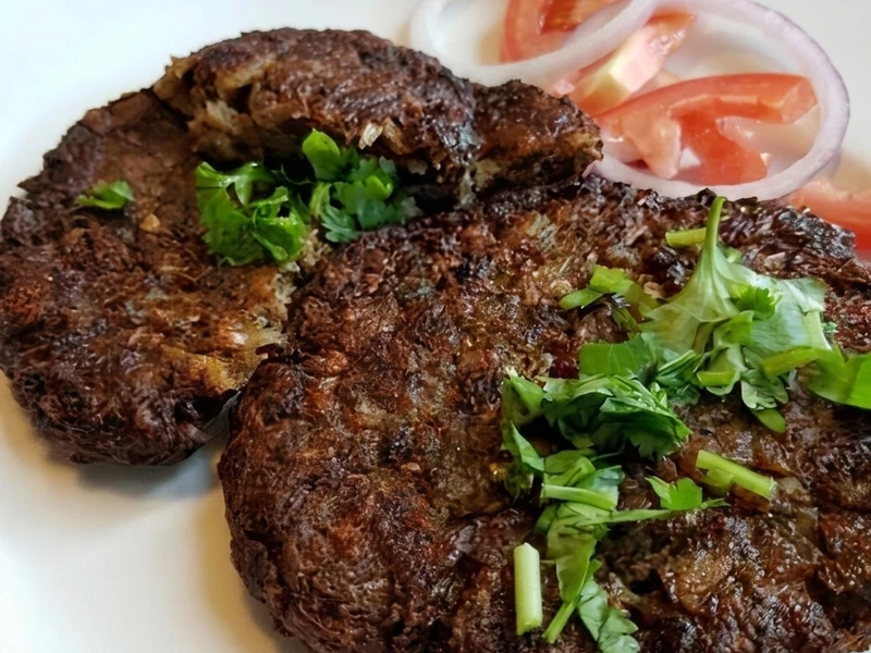 Beef Chapli Kabab at Chutney Express Edmonton - spiced flattened beef patty served with naan